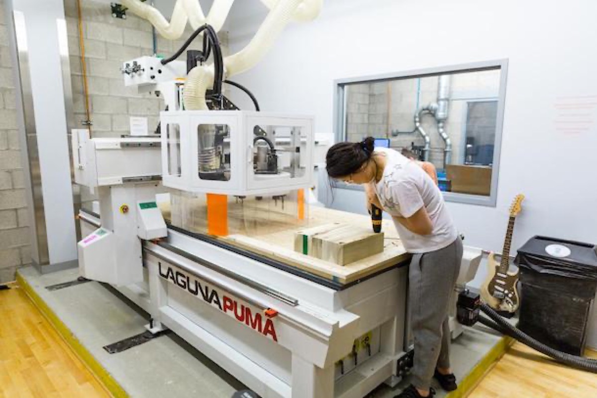 Operator working at an industrial CNC machining center